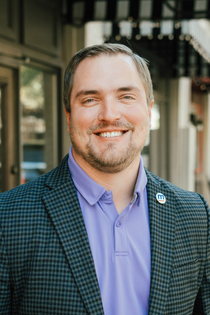 Gerrit Burke, Vice President of Engineering for MartinFed's headshot, wearing a polo shirt and blazer