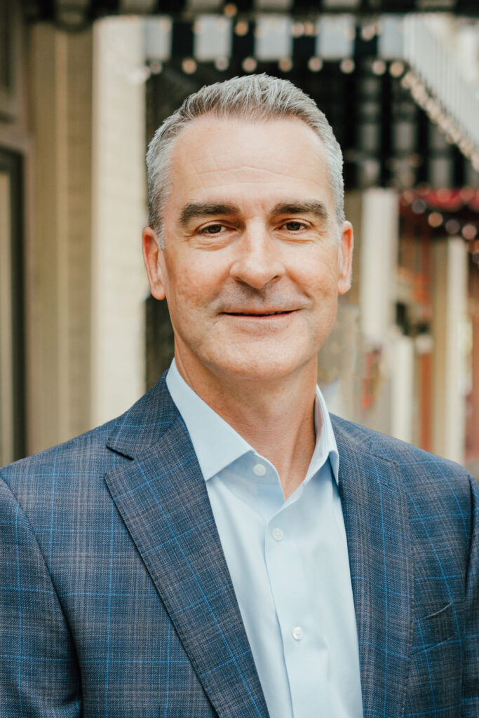 Ted Martin, MartinFed's Executive Vice President of Federal Solutions, headshot in a button-up shirt and blazer