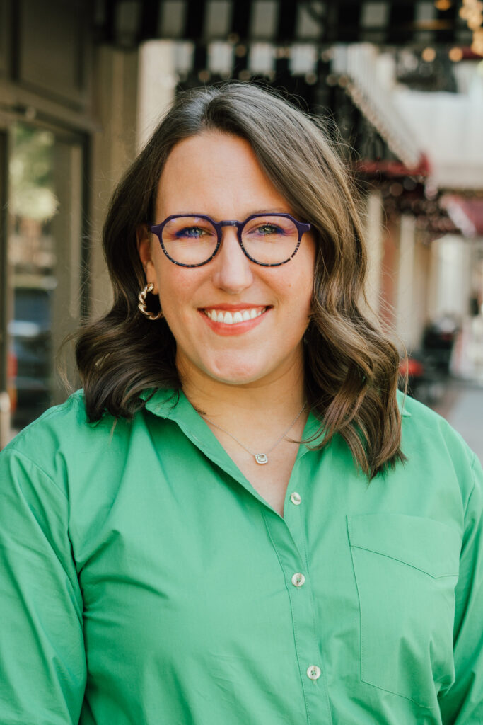 Anna Parks, Vice President of Operations for MartinFed's headshot, wearing a green button down shirt